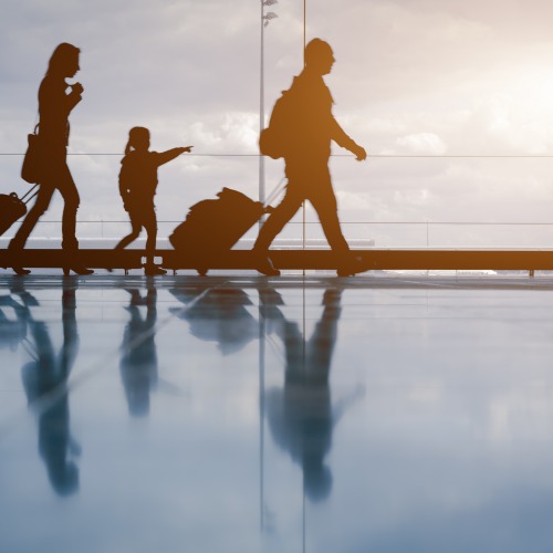 Family walking through an airport terminal